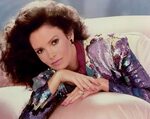 JACLYN SMITH - POSING ON COUCH